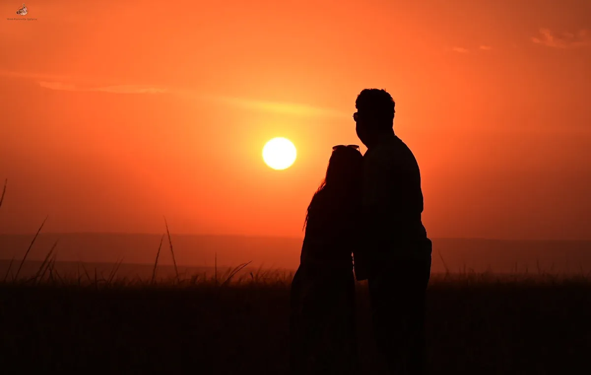 Couple watching sunset during a private Kenya honeymoon safari